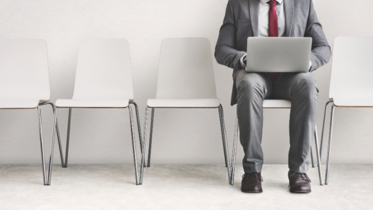 Man waiting for a job interview after losing his job due to AI