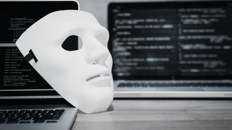 A mask kept over a laptop.