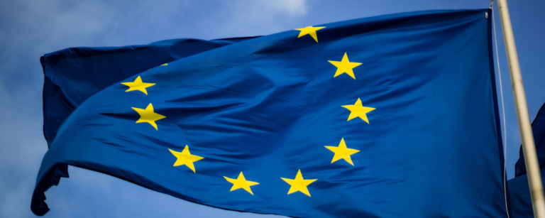 European Union flag with stars representing EU member states, symbolizing EU's amended AI Act regulations