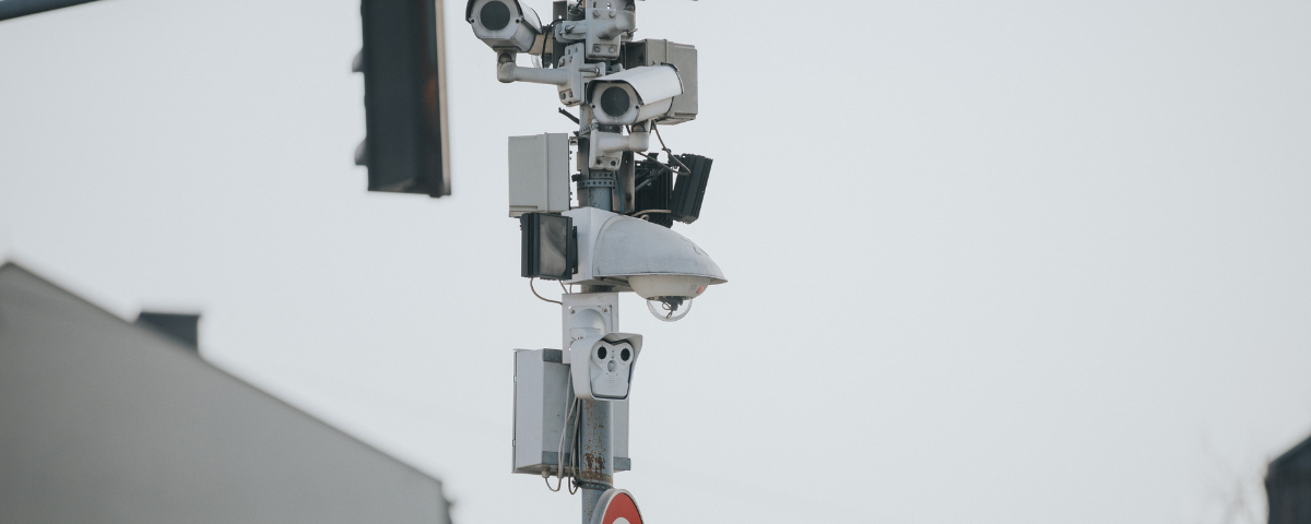 stock picture of cctv cameras mounted at a traffic signal