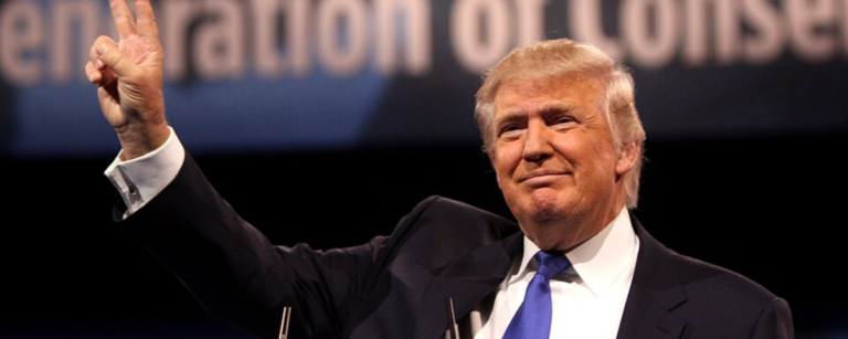 US President Donald Trump at a public event, ahead of signing an AI executive order requiring 90-day government access to frontier models