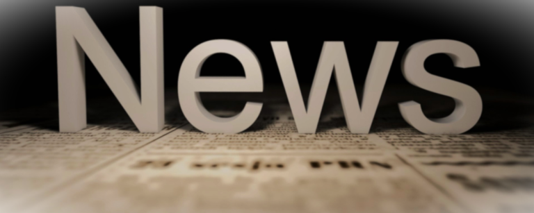 he word “News” displayed in large letters on top of a newspaper background.