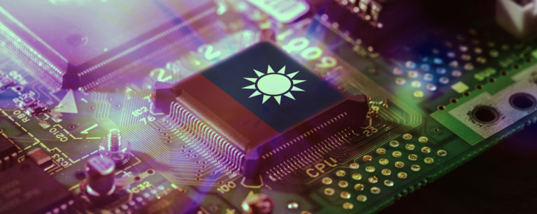 Taiwan flag displayed on a semiconductor chip mounted on a circuit board.