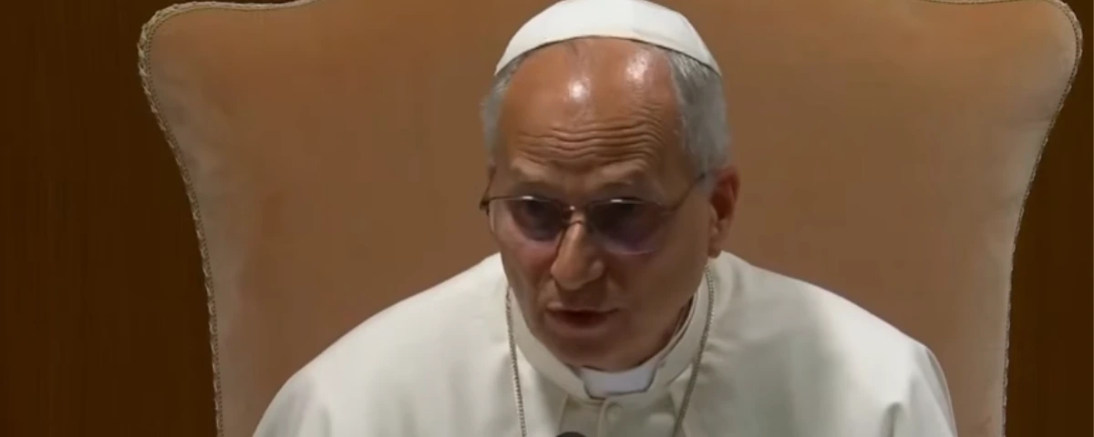 Pope Leo XIV speaking while seated during a Vatican address.
