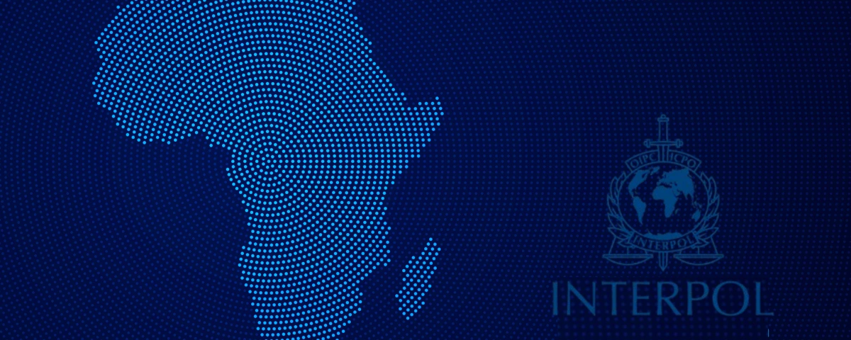 Dotted map of Africa beside the INTERPOL logo on a dark blue background
