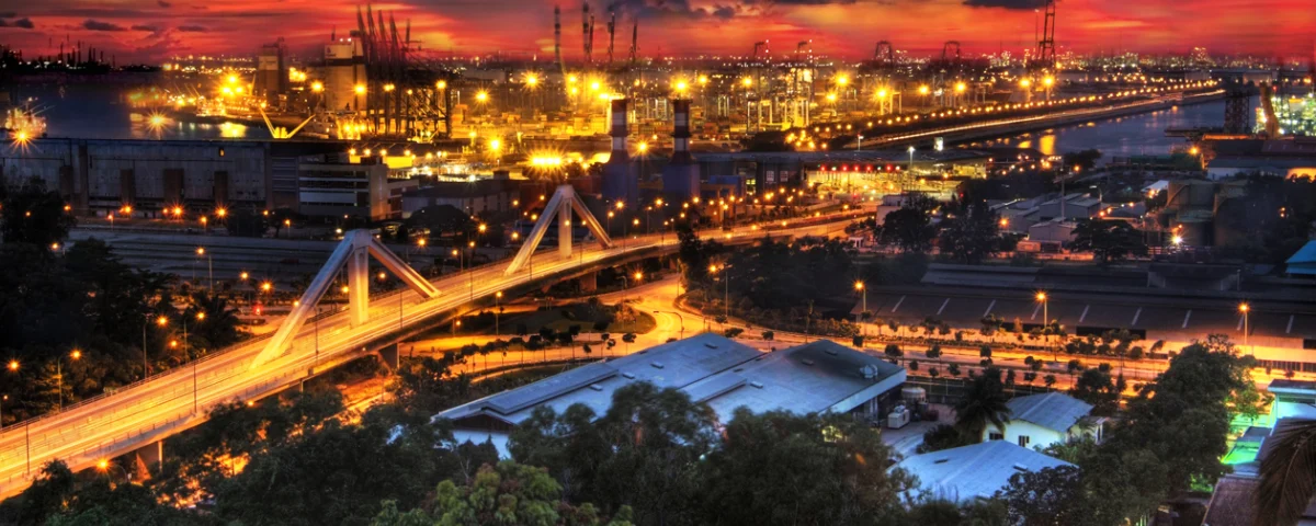 Singapore’s Jurong Island industrial area at night, with port facilities, roads and industrial infrastructure.