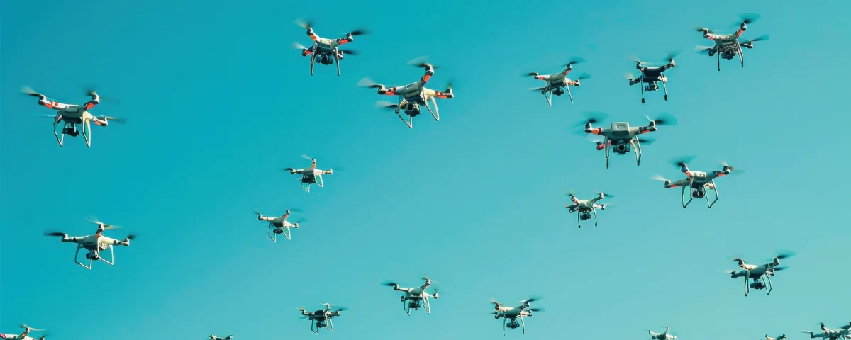 AI-enabled drones representing autonomous weapons and AI-assisted battlefield targeting