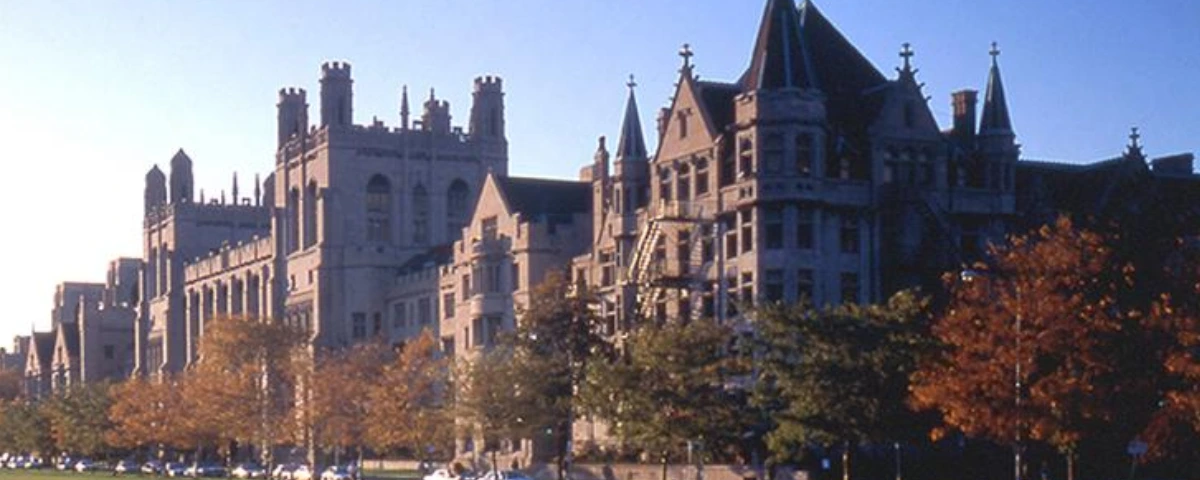 University of Chicago campus buildings with Gothic-style architecture and autumn trees.