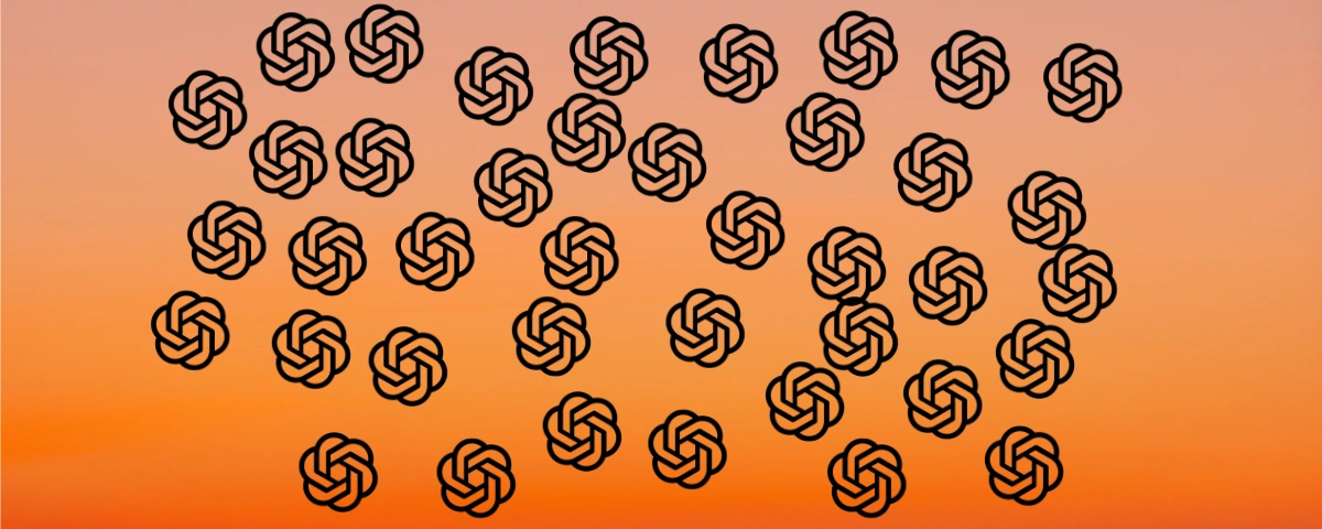 several logos of OpenAI pasted on the background of orange color screen.