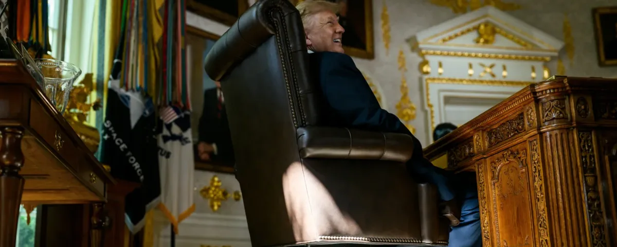 Donald Trump seated at a desk as he announces an AI Force and proposes renaming artificial intelligence