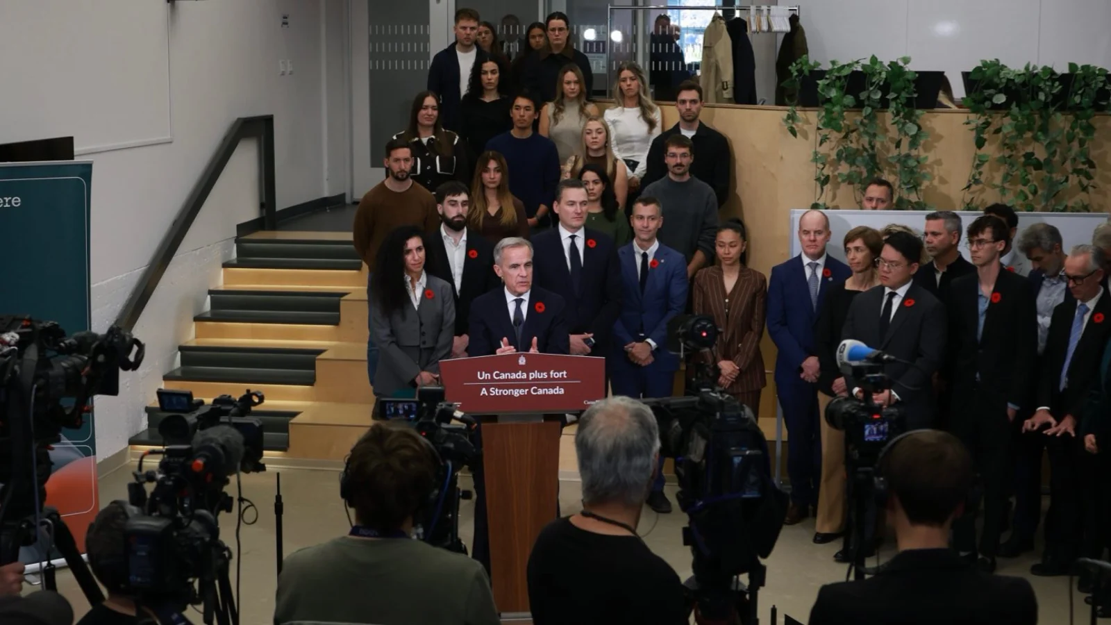 Mark Carney announces Canada's C$1.6 billion investment in Cohere and new national security strategy at a press conference.