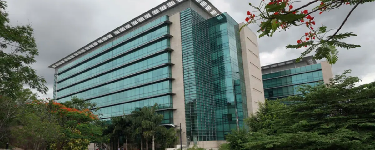 Microsoft office building in Hyderabad, India, with a modern glass facade.