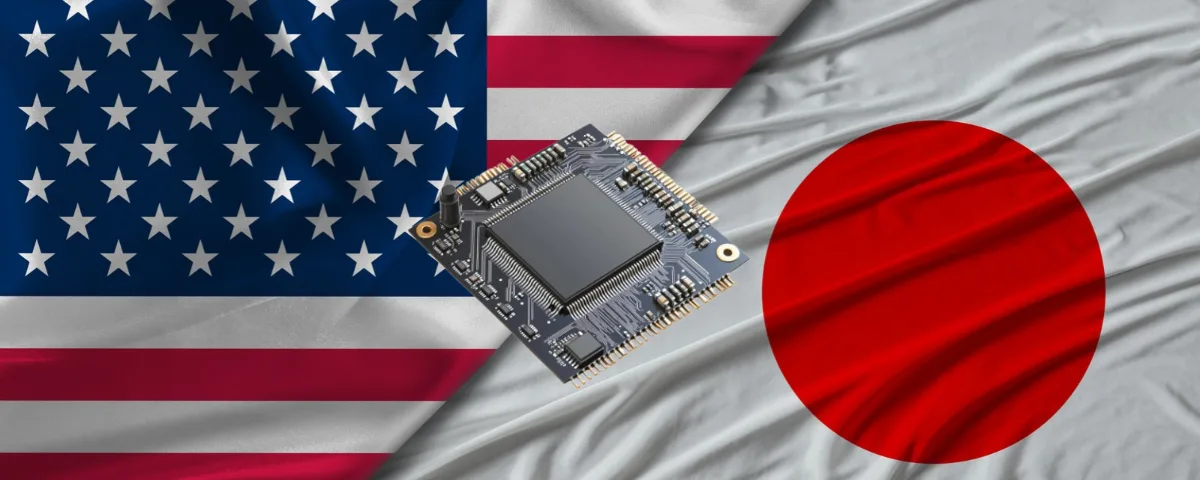 US and Japanese flags behind a semiconductor chip, representing Japan's planned investment of up to $21 billion in GlobalFoundries chip plants in New York.
