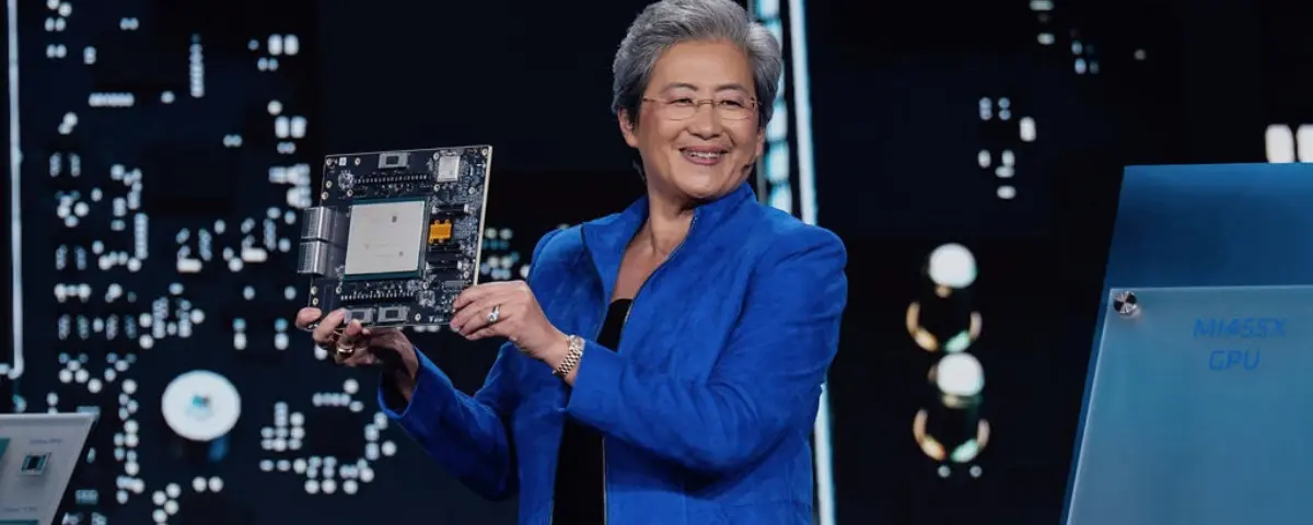 AMD CEO Lisa Su holding a semiconductor board during an AMD event