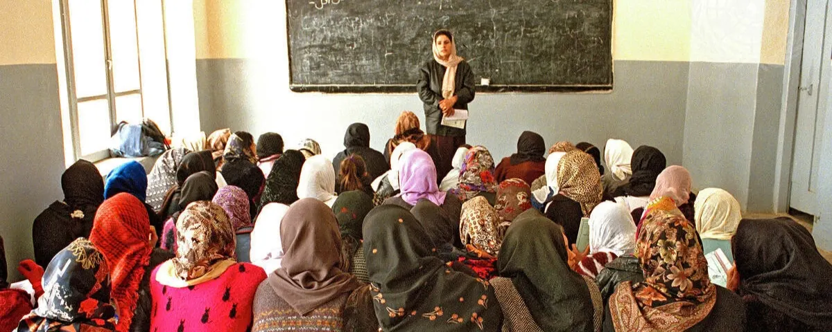 Teacher conducting a classroom lesson with students as AI transforms education