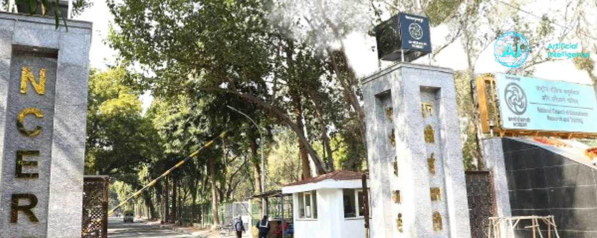 Entrance gate of the National Council of Educational Research and Training (NCERT) campus, with the NCERT signboard and surrounding trees.